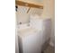 Laundry room features washer, dryer, shelving, and utility sink at 87 Vivante Blvd # 8742, Punta Gorda, FL 33950