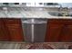 Stainless steel dishwasher in a kitchen with granite countertops at 87 Vivante Blvd # 8742, Punta Gorda, FL 33950