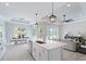 Contemporary kitchen with a spacious island, stainless steel appliances, and an open floor plan into the living spaces at 13348 Rayburn Ln, Port Charlotte, FL 33981