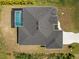 Aerial view showcasing the home's layout and backyard pool at 13348 Rayburn Ln, Port Charlotte, FL 33981