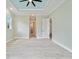 Large primary bedroom with light-green walls and tray ceiling design at 13348 Rayburn Ln, Port Charlotte, FL 33981