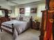 Bedroom with wooden furniture and tiled floors at 65 Ocean Dr, Punta Gorda, FL 33950