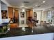 Modern kitchen with granite counters, stainless steel appliances, and breakfast bar at 65 Ocean Dr, Punta Gorda, FL 33950