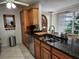 Kitchen with granite countertops, stainless steel appliances, and wood cabinets at 65 Ocean Dr, Punta Gorda, FL 33950