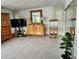 Bright living room with tiled floors, large TV, and wood furniture at 65 Ocean Dr, Punta Gorda, FL 33950