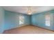 This spacious bedroom features tile flooring, a ceiling fan, and two windows for ample natural light at 7263 Sablon Rd, North Port, FL 34291
