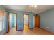 Bedroom featuring tile floors, two doors, and a view to the en-suite bathroom at 7263 Sablon Rd, North Port, FL 34291