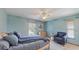Serene bedroom with soothing colors and a comfortable seating area by the window at 7263 Sablon Rd, North Port, FL 34291