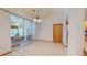 Bright dining area with glass doors leading to the pool and outdoor seating at 7263 Sablon Rd, North Port, FL 34291