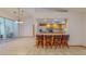 Open-concept kitchen with stainless steel appliances and a breakfast bar at 7263 Sablon Rd, North Port, FL 34291