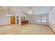 Open living area with a kitchen bar, lots of floor space, and natural light at 7263 Sablon Rd, North Port, FL 34291