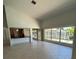 Bright living room, water view, tile floors, and kitchen access at 65 Ocean Dr, Punta Gorda, FL 33950