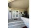 Front entry with double doors, stone planter and a tiled walkway at 65 Ocean Dr, Punta Gorda, FL 33950