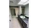 Bathroom with tub/shower combo and dark vanity at 65 Ocean Dr, Punta Gorda, FL 33950