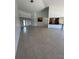 Spacious living room with tile floors and access to kitchen at 65 Ocean Dr, Punta Gorda, FL 33950