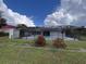 Screened-in pool area with grassy backyard at 4419 Crews Ct, Port Charlotte, FL 33952