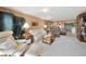Living room with light leather sofas and a view into kitchen and dining area at 150 Harborside Ave # 314, Punta Gorda, FL 33950