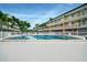 Inviting community pool with building in background at 150 Harborside Ave # 314, Punta Gorda, FL 33950