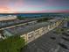 Condo building exterior and parking lot at sunset at 150 Harborside Ave # 314, Punta Gorda, FL 33950