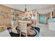 Charming dining area with a round table and view into living room at 150 Harborside Ave # 314, Punta Gorda, FL 33950