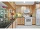 Kitchen features granite countertops and light wood cabinets at 150 Harborside Ave # 314, Punta Gorda, FL 33950