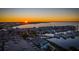 Aerial view of waterfront property with sunset, marina, and boat slips at 150 Harborside Ave # 314, Punta Gorda, FL 33950