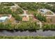 Bird's-eye view of a house near the water, showcasing its location and surroundings at 820 Bowman Ter, Port Charlotte, FL 33953