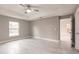 Spacious bedroom with ceiling fan and large window at 820 Bowman Ter, Port Charlotte, FL 33953