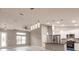 Open concept living room and kitchen with modern finishes and island at 820 Bowman Ter, Port Charlotte, FL 33953