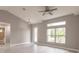 Living room with large window, tile floors, and high ceilings at 820 Bowman Ter, Port Charlotte, FL 33953