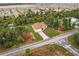 Aerial view of a house with a driveway and surrounding neighborhood at 820 Bowman Ter, Port Charlotte, FL 33953