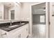 Bathroom with double vanity, granite countertop and view of bedroom at 820 Bowman Ter, Port Charlotte, FL 33953