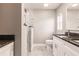 Modern bathroom with double vanity, granite countertop, and glass shower enclosure at 820 Bowman Ter, Port Charlotte, FL 33953