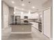 Modern kitchen with white cabinets, granite countertops, and stainless steel appliances at 820 Bowman Ter, Port Charlotte, FL 33953