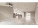 Open living room with kitchen, high ceiling, and tile floors at 820 Bowman Ter, Port Charlotte, FL 33953