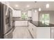 Modern kitchen with stainless steel appliances and granite countertops at 820 Bowman Ter, Port Charlotte, FL 33953