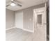 Bedroom with double closet, ceiling fan, and access to hallway at 820 Bowman Ter, Port Charlotte, FL 33953