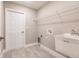 Laundry room with utility sink and shelving at 820 Bowman Ter, Port Charlotte, FL 33953