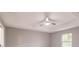 Bright bedroom with ceiling fan and window at 820 Bowman Ter, Port Charlotte, FL 33953