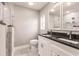 Modern bathroom with double vanity, granite countertop, and walk-in shower at 820 Bowman Ter, Port Charlotte, FL 33953