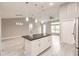 Large kitchen island with granite countertop and white cabinets at 820 Bowman Ter, Port Charlotte, FL 33953