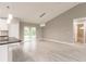 Spacious dining area with wood-look floors and access to patio at 820 Bowman Ter, Port Charlotte, FL 33953