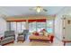 Sunroom with pool view and comfortable seating at 7263 Sablon Rd, North Port, FL 34291