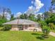 House exterior with palm trees and flag at 7263 Sablon Rd, North Port, FL 34291