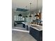 Modern kitchen features pendant lighting, marble countertop island, and stainless-steel appliances at 1426 Mineo Dr, Punta Gorda, FL 33950