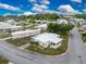 Aerial view of a mobile home community with tree-lined streets at 6405 Kilohee Ct, North Port, FL 34287