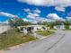 Front view of a manufactured home with landscaping and a paved driveway at 6405 Kilohee Ct, North Port, FL 34287