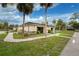 Community center with landscaping and walkway at 6405 Kilohee Ct, North Port, FL 34287