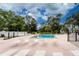 Inviting community pool with lounge chairs, surrounded by lush landscaping at 6405 Kilohee Ct, North Port, FL 34287