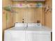 Laundry room with washer, dryer, and overhead shelving at 6405 Kilohee Ct, North Port, FL 34287